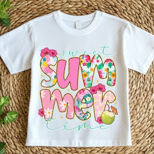May include: White t-shirt featuring the text "Sweet Summer Time" in pink and floral patterns. The word "Summer" is prominent, with a coconut and floral accents.
