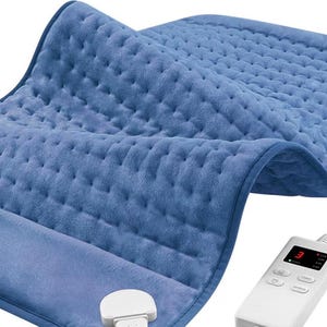 May include: A blue, quilted heating pad with a white control panel. The pad is made of a soft, plush material. The control panel displays a digital number and has buttons for adjusting the heat settings.