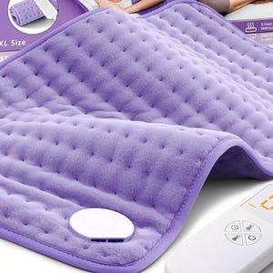 May include: A lavender XL size heating pad with a quilted texture and a white control panel. The control panel displays the temperature and has buttons for adjusting the heat settings. The packaging shows the product's features.