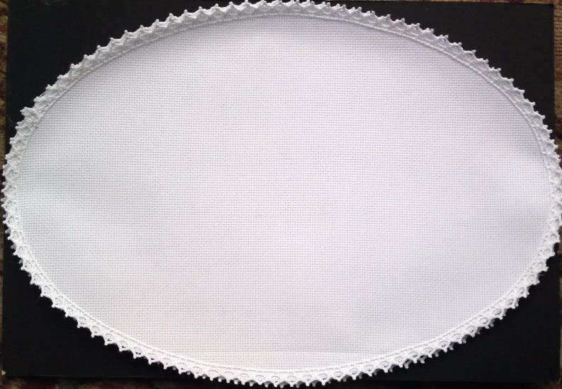 Oval Table Centre to Cross Stitch 14 count aida with a cotton lace edge