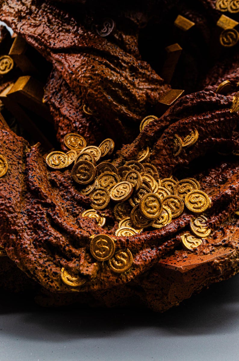 May include: Close-up of a treasure trove featuring gold coins and bars. The coins are embossed with a dollar sign and scattered across a textured, brown surface. The scene evokes wealth and prosperity.