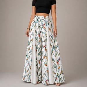May include: High-waisted wide-leg trousers featuring a white base with a repeating pattern of vertical, interconnected leaf-like shapes in shades of teal, orange, and brown. The garment has a structured waistband and a floor-length, flowing silhouette.