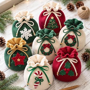 May include: A collection of seven round, crocheted drawstring pouches in red, green, and cream colours. Each pouch features a unique holiday-themed appliqué, including a snowflake, Christmas tree, wreath, poinsettia, candy cane, and holly berries.