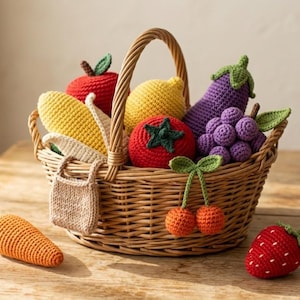 May include: A woven wicker basket filled with various crocheted fruits and vegetables, including a yellow corn cob, red apple, yellow lemon, purple eggplant, red tomato, and purple grapes. A small beige bag, orange carrot, red strawberry, and mushroom are also present.