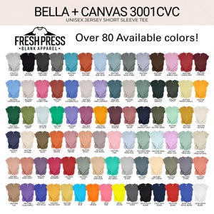 May include: A display of unisex short sleeve tees in various colors, including heather gray, black, and blue. The image showcases over 80 available colors of the Bella + Canvas 3001CVC shirts, with the Fresh Press Blank Apparel logo at the top.