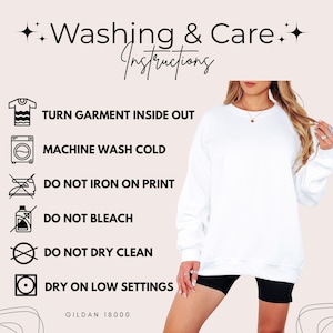 May include: White crewneck sweatshirt with washing instructions. The text reads: Turn garment inside out, machine wash cold, do not iron on print, do not bleach, do not dry clean, dry on low settings. The brand is Gildan 18000.