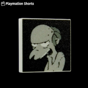 May include: A square tile with a cartoon illustration of a character with a bald head, long nose, and a surprised expression. The character is in shades of grey against a black background. The tile has white edges.