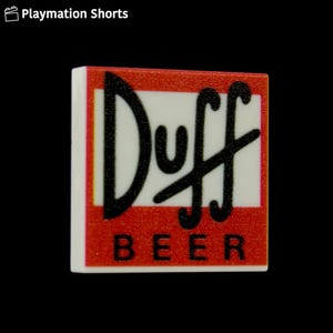 May include: A square, white tile with the "Duff Beer" logo. The logo features the word "Duff" in black, stylized lettering over the word "BEER" in black, block letters. The background is red with a white border.