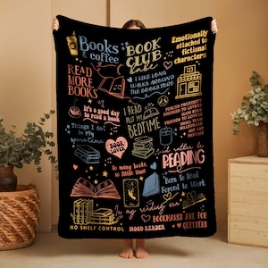 May include: Black throw blanket with colorful text and illustrations related to reading and books. Phrases include "Books & coffee", "Book Club", "Read More Books", and "I'd rather be reading".