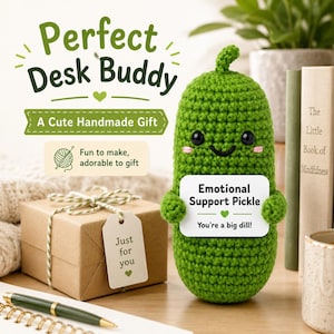 May include: A handmade green crochet pickle with a smiling face and a sign that reads "Emotional Support Pickle." The image also includes a gift box with a tag that says "Just for you."