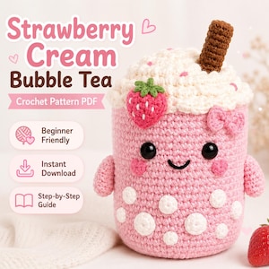 May include: A crochet pattern PDF for a Strawberry Cream Bubble Tea plushie. The plushie is pink with white boba pearls, a white whipped cream top, a brown straw, a small red strawberry, and a pink bow. It features black eyes and a smile.