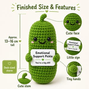 May include: A green crocheted pickle with a cute face, tiny hands, and a stem. It holds a sign that reads "Emotional Support Pickle, You're a big dill!" The desk-sized charm is approximately 5.1 to 6.3 inches tall.