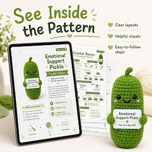 May include: A crochet pattern for an "Emotional Support Pickle" is displayed on a tablet and printed pages. The pattern includes clear layouts, helpful visuals, and easy-to-follow steps. A finished green pickle toy holds a sign that says "You're a big dill!"
