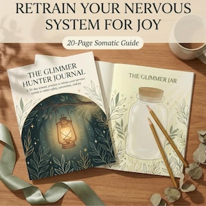 May include: Two open journals with the titles "The Glimmer Hunter Journal" and "The Glimmer Jar" are displayed on a wooden surface. The first journal features a lantern illustration, while the second shows a jar with pencils. The text "Retrain Your Nervous System For Joy" is at the top.