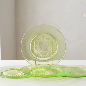 Title: Set of 4 Vintage Uranium Glass Plates | Starburst Pattern Depression Glass | UV Reactive Glowing Green | Excellent Condition