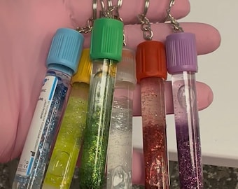 Gepersonaliseerde sleutelhangers glitterflebotomie