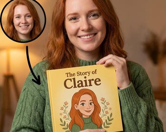 May include: A personalized children's book titled "The Story of Claire" with a cartoon illustration of a red-haired girl on the cover. The book has a yellow background and is held by a person wearing a green sweater. A circular portrait of the girl is in the upper left.