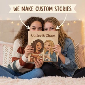 May include: Two people holding a book titled "Coffee & Chaos." The book cover features an illustration of two smiling women with coffee cups. The text "We Make Custom Stories" is above the book. The background includes a bed with pillows and string lights.