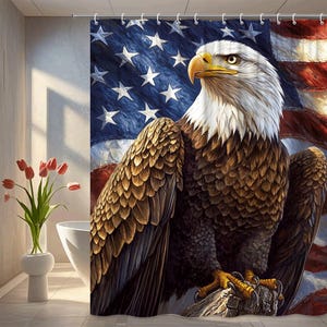 May include: A shower curtain featuring a detailed illustration of a bald eagle with a white head, brown feathers, and a yellow beak and talons. The background displays the American flag with red and white stripes and white stars on a blue field.