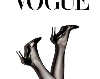 May include: Black high-heeled shoes and sheer black stockings are featured in this image. The word "VOGUE" is displayed in bold, black capital letters at the top of the image. The legs are crossed, with the heels pointing upwards against a white background.