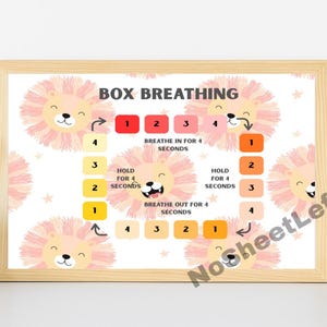May include: A framed print with the words "BOX BREATHING" and a lion illustration. The print shows a box breathing exercise with numbered steps and instructions to breathe in, hold, and breathe out for 4 seconds each. The background is white with lion faces.