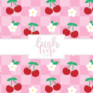 May include: A pink checkered pattern featuring red cherries and white flowers. The design includes the text "Lush Loop Studio" within a white rectangular box with a dashed border.