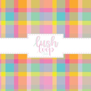 May include: A colorful plaid pattern in shades of pink, orange, yellow, green, and blue. The design features a white rectangular space with the text "lush loop Studio" in a cursive font.