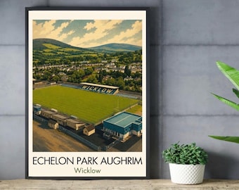 May include: A framed poster featuring an aerial view of Echelon Park Aughrim in Wicklow, Ireland. The image displays a green sports field, blue stadium seating with the text WICKLOW, and surrounding hills. The text ECHELON PARK AUGHRIM Wicklow is below.