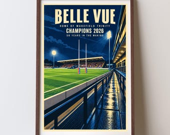 May include: A framed poster featuring a night stadium scene at Belle Vue, home of Wakefield Trinity. The text reads: BELLE VUE, HOME OF WAKEFIELD TRINITY, CHAMPIONS 2026, 58 YEARS IN THE MAKING. The illustration shows a green rugby pitch, goalposts, and stadium lights.