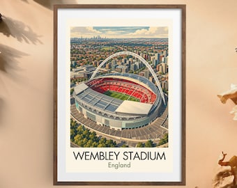 May include: A framed art print featuring an aerial illustration of Wembley Stadium in England, showcasing the iconic white arch, red seating, and green pitch, with the text WEMBLEY STADIUM England printed in black and green at the bottom.