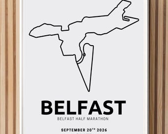 May include: A framed white poster featuring a black line drawing of the Belfast Half Marathon route. The text reads BELFAST, BELFAST HALF MARATHON, SEPTEMBER 20TH 2026, and 21.1KM. The design is presented in a simple white frame with a clean layout.