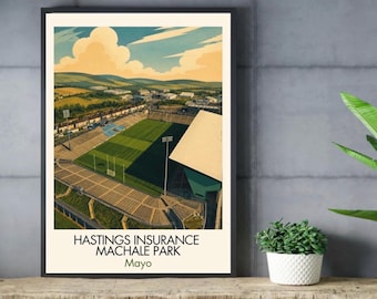 May include: A framed art print featuring an aerial illustration of Hastings Insurance MacHale Park in Mayo. The image depicts a green sports field, stadium seating, and a large white roof structure under a blue sky with clouds. Text reads: HASTINGS INSURANCE MACHALE PARK Mayo.