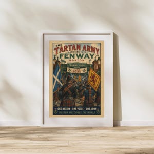 May include: A framed poster titled The Tartan Army Marches Into Fenway Boston, featuring a crowd of people in kilts, the Scottish flag, and a lion rampant flag. The text reads June 2026, Fenway Park, and One Nation One Voice One Army Boston Welcomes The World.