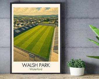 May include: A framed art print featuring an aerial view of Walsh Park stadium in Waterford, Ireland. The image displays a bright green grass pitch with striped patterns, surrounding stadium seating, and the text Walsh Park Waterford.