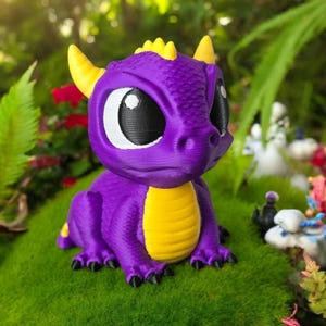 May include: A purple dragon figurine with yellow horns and belly, and black eyes. The dragon is sitting on a bed of green moss, with a blurred background of greenery and flowers. The figurine is a 3D-printed item.