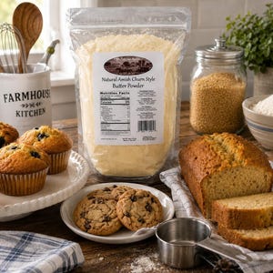 Millstone Acres Natural Salted Butter Powder displayed with homemade muffins, cookies, and quick bread in a bright farmhouse baking scene.