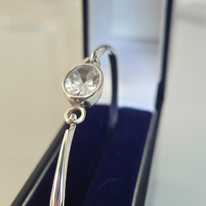 Beautiful boxed Kit Heath designer clear stone Sterling silver bangle