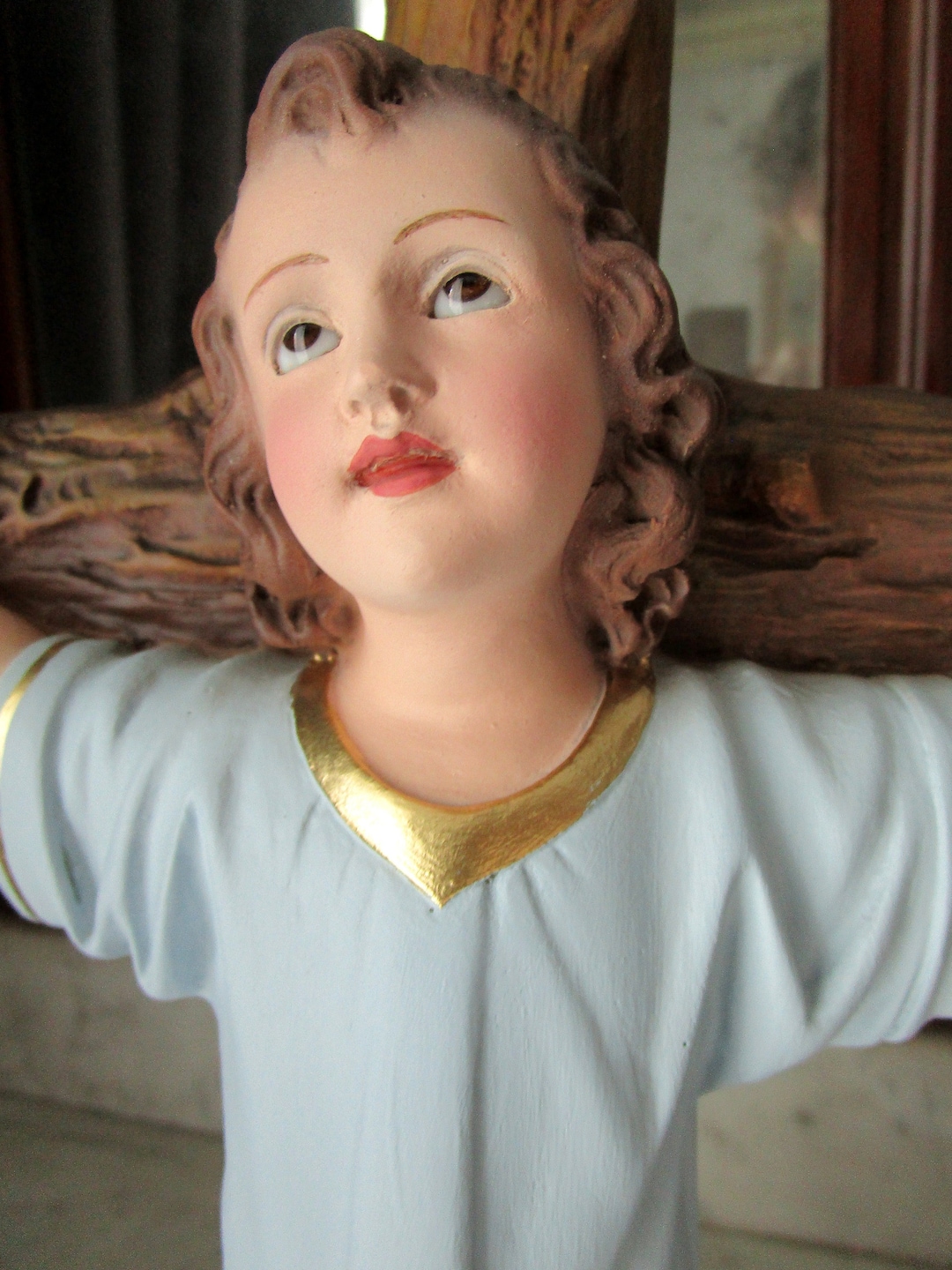 Infant Child Jesus on the Cross . Religious Statue Jesus Christ of the