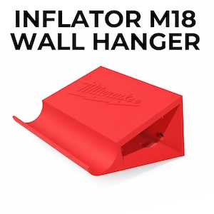 May include: A bright red wall hanger for an inflator, with the text "INFLATOR M18 WALL HANGER" at the top. The Milwaukee logo is embossed on the top surface. The hanger is designed to hold an inflator and is made of a solid material.