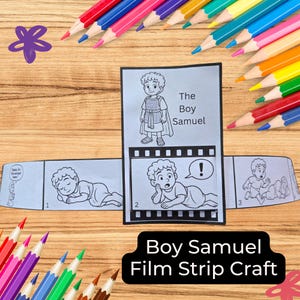 May include: A film strip craft titled "Boy Samuel" with illustrations of a young boy. The craft is surrounded by colorful pencils on a wooden surface. The film strip shows the boy in different scenes.