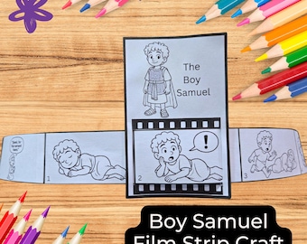 May include: A "Boy Samuel" film strip craft with illustrations of a young boy. The craft is surrounded by colourful pencils on a wooden surface. The film strip shows the boy in different scenes.