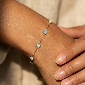 May include: A set of three ceramic mugs with a speckled, matte finish. The mugs are in shades of cream, light gray, and dark gray. Each mug has a simple, minimalist design, perfect for coffee or tea.