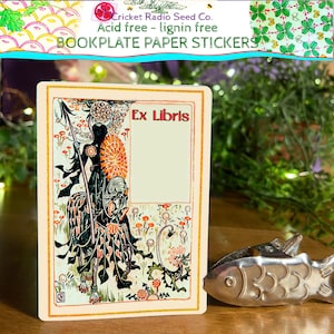 May include: Cream-coloured bookplate paper sticker with an illustration of a figure on horseback, holding a spear. The text "Ex Libris" is in red. The top of the sticker reads "Cricket Radio Seed Co. Acid free - lignin free BOOKPLATE PAPER STICKERS."