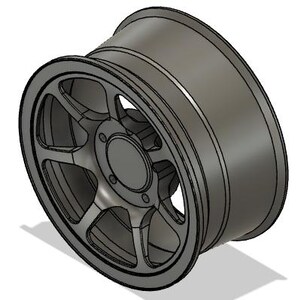 May include: A gray alloy wheel with a multi-spoke design. The wheel has a central hub with bolt holes and a deep dish profile. The rim is a dark gray color, and the wheel appears to be new.