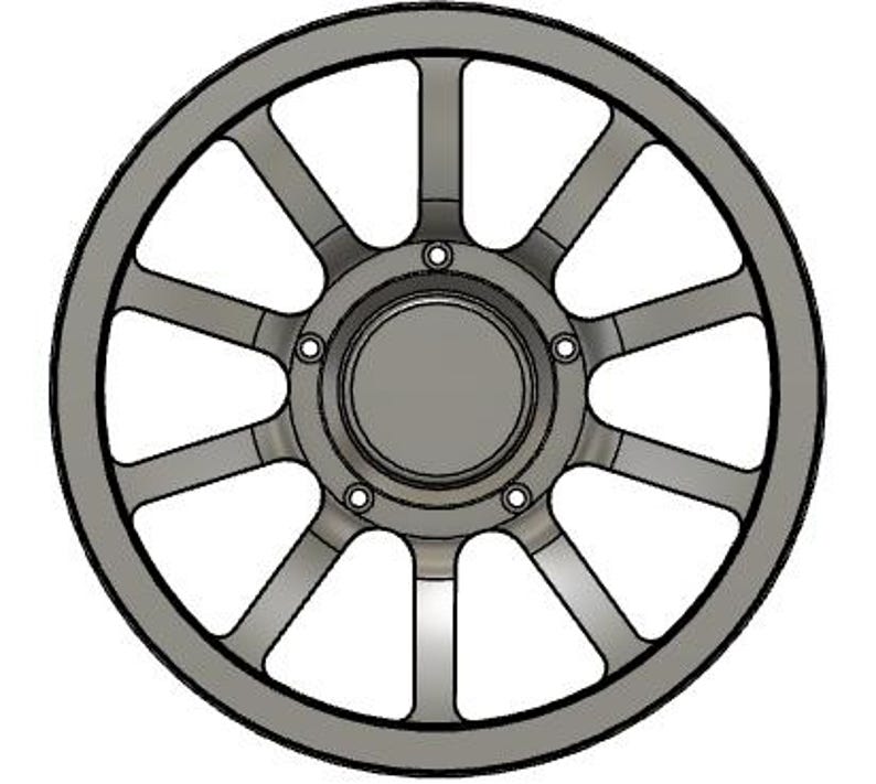 May include: A gray, stylized wheel with a circular design. The wheel features multiple spokes radiating from a central hub, with a series of small circular details around the hub. The outer rim is a darker gray, creating a defined edge.