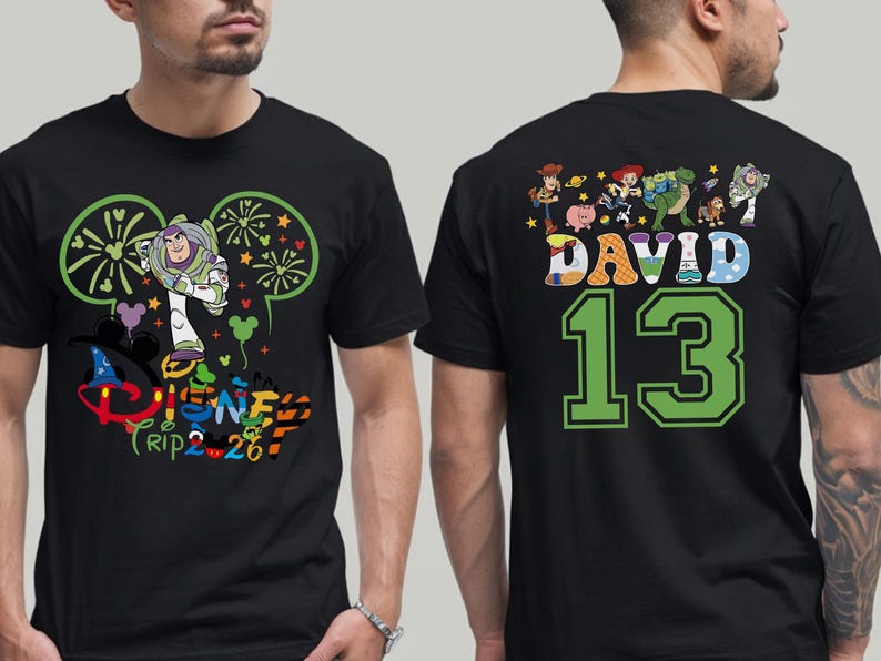 May include: Black t-shirt featuring Buzz Lightyear and Disney Trip 2.26 graphics on the front. The back displays Toy Story characters, the name "DAVID", and the number "13" in green.