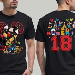 May include: Black t-shirt featuring Mickey Mouse and other Disney characters. The front design includes the text "Disney Trip 26". The back of the shirt has the name "ROBER" and the number "18".