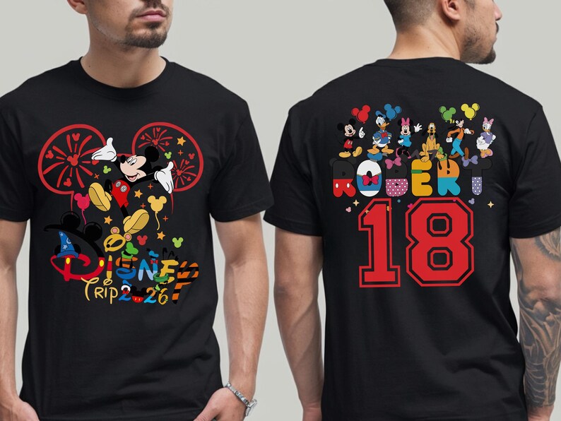 May include: Black t-shirt featuring Mickey Mouse and other Disney characters. The front design includes the text "Disney Trip 26". The back of the shirt has the name "ROBER" and the number "18".