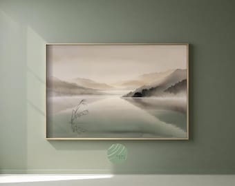May include: A framed landscape print showing a tranquil lake scene with misty mountains. The artwork uses soft, muted tones of green, beige, and grey, creating a peaceful atmosphere. A few reeds are in the foreground.