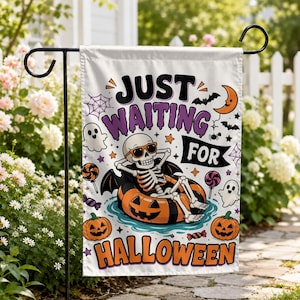May include: A white garden flag featuring a skeleton wearing sunglasses and relaxing in an orange jack-o'-lantern pool float. The text reads JUST WAITING FOR HALLOWEEN, surrounded by illustrations of ghosts, bats, spiders, and candy.